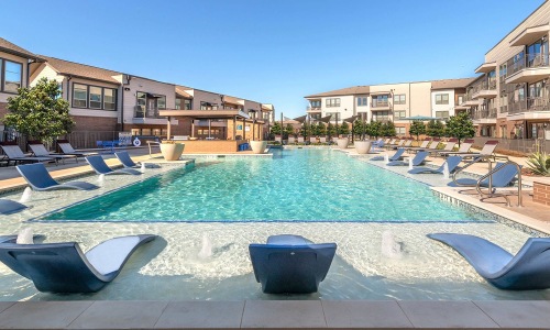 Resort-style pool with cabanas at 301 Flower Mound, Flower Mound TX apartments.
