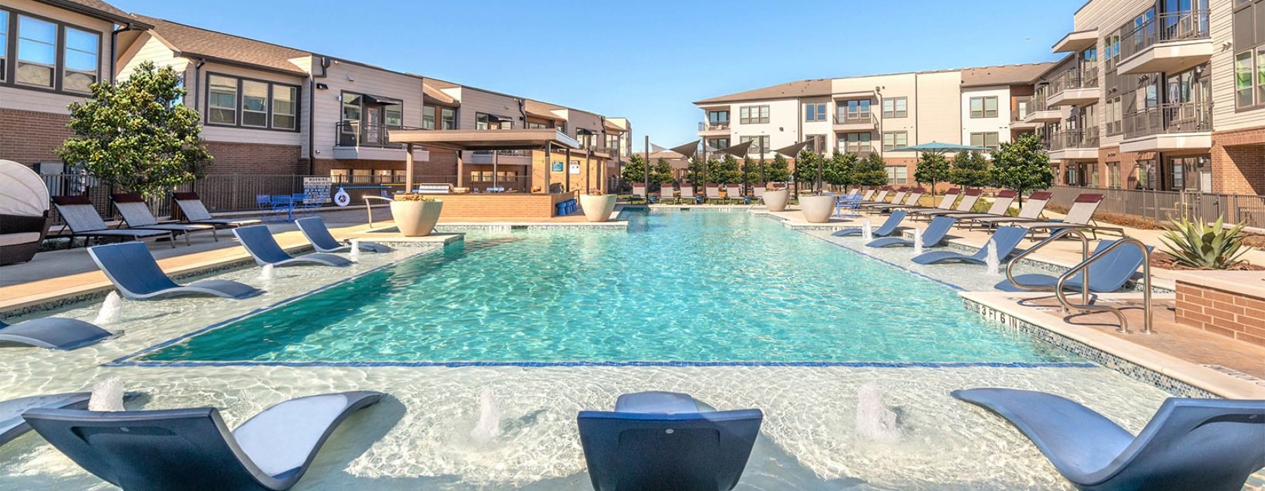Resort-style pool with cabanas at 301 Flower Mound, Flower Mound TX apartments.
