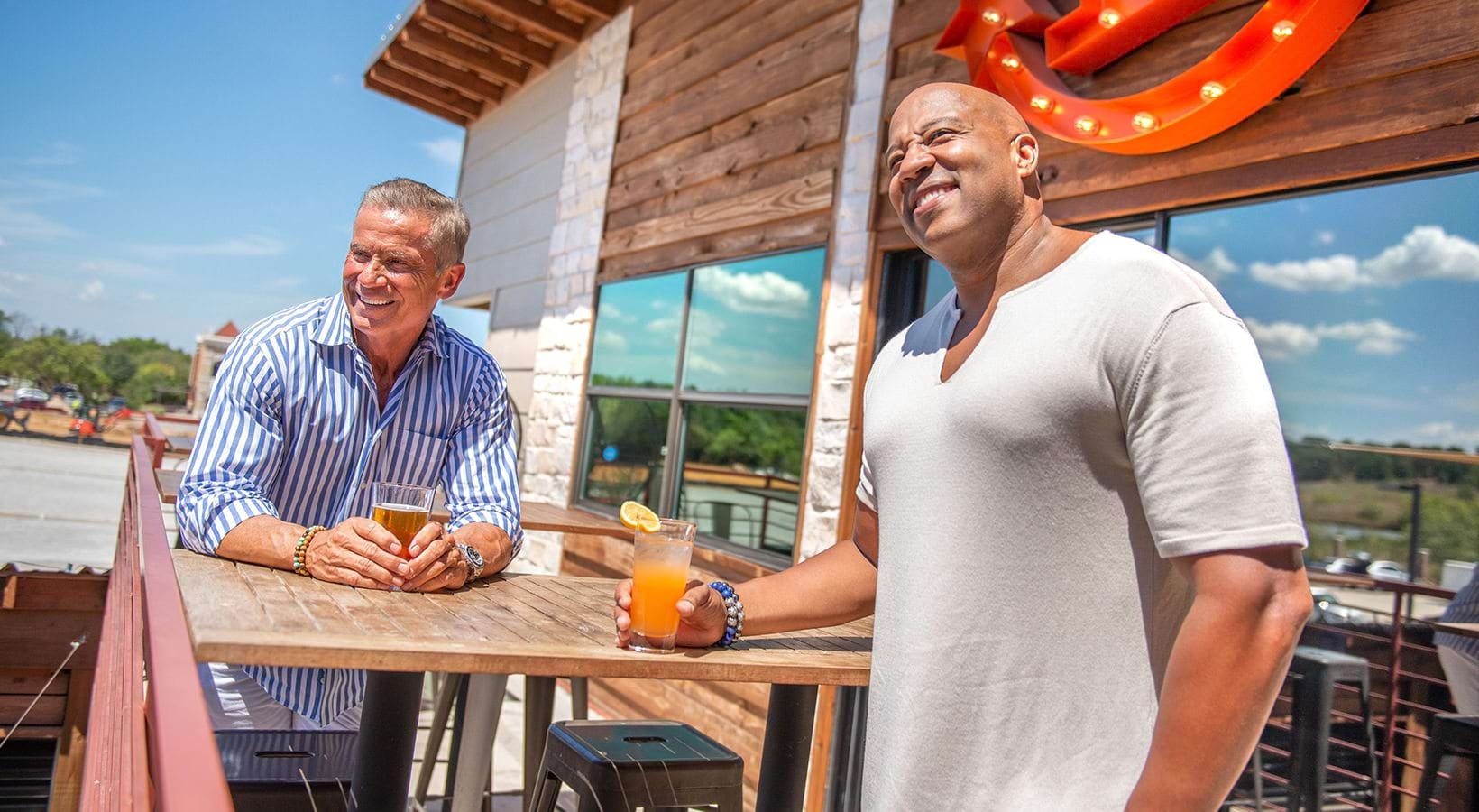 Lifestyle at 301 Flower Mound Friends outside enjoying a drink near the river